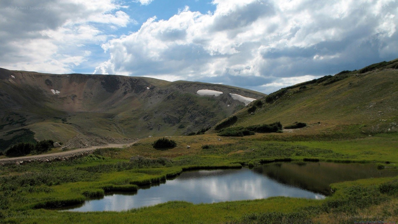 mountain valley with pond