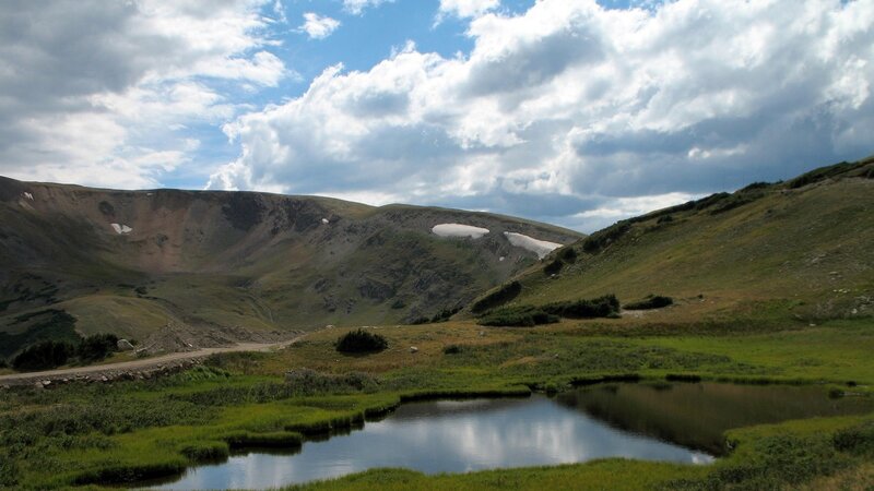 mountain valley with pond