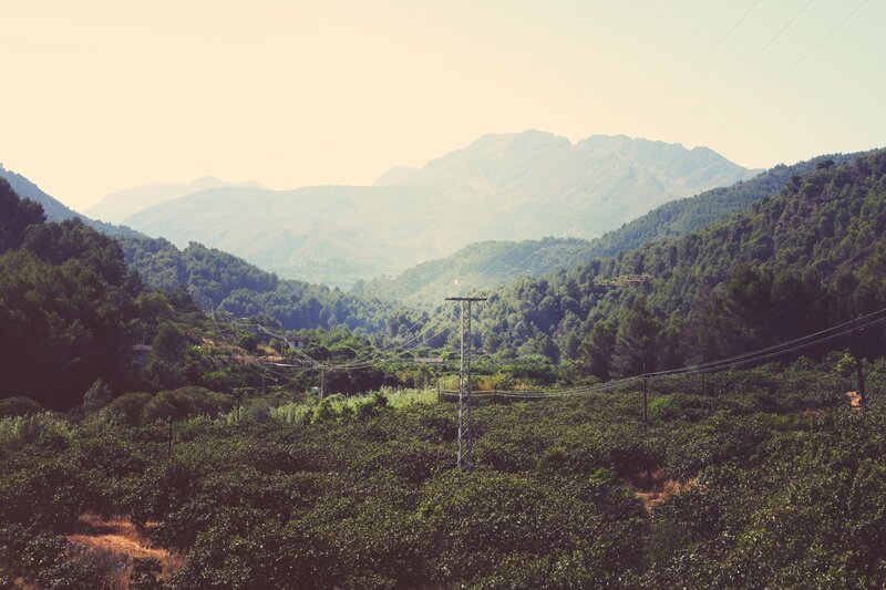 Mountain valley with power lines