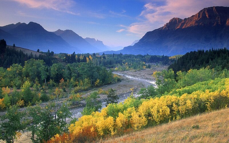 Mountain valley with river and autumn trees