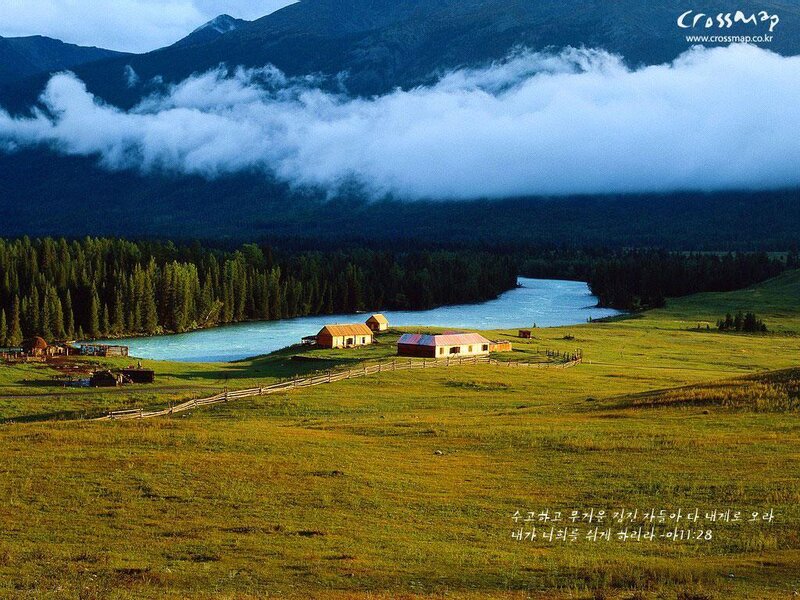 Mountain valley with river and cabins