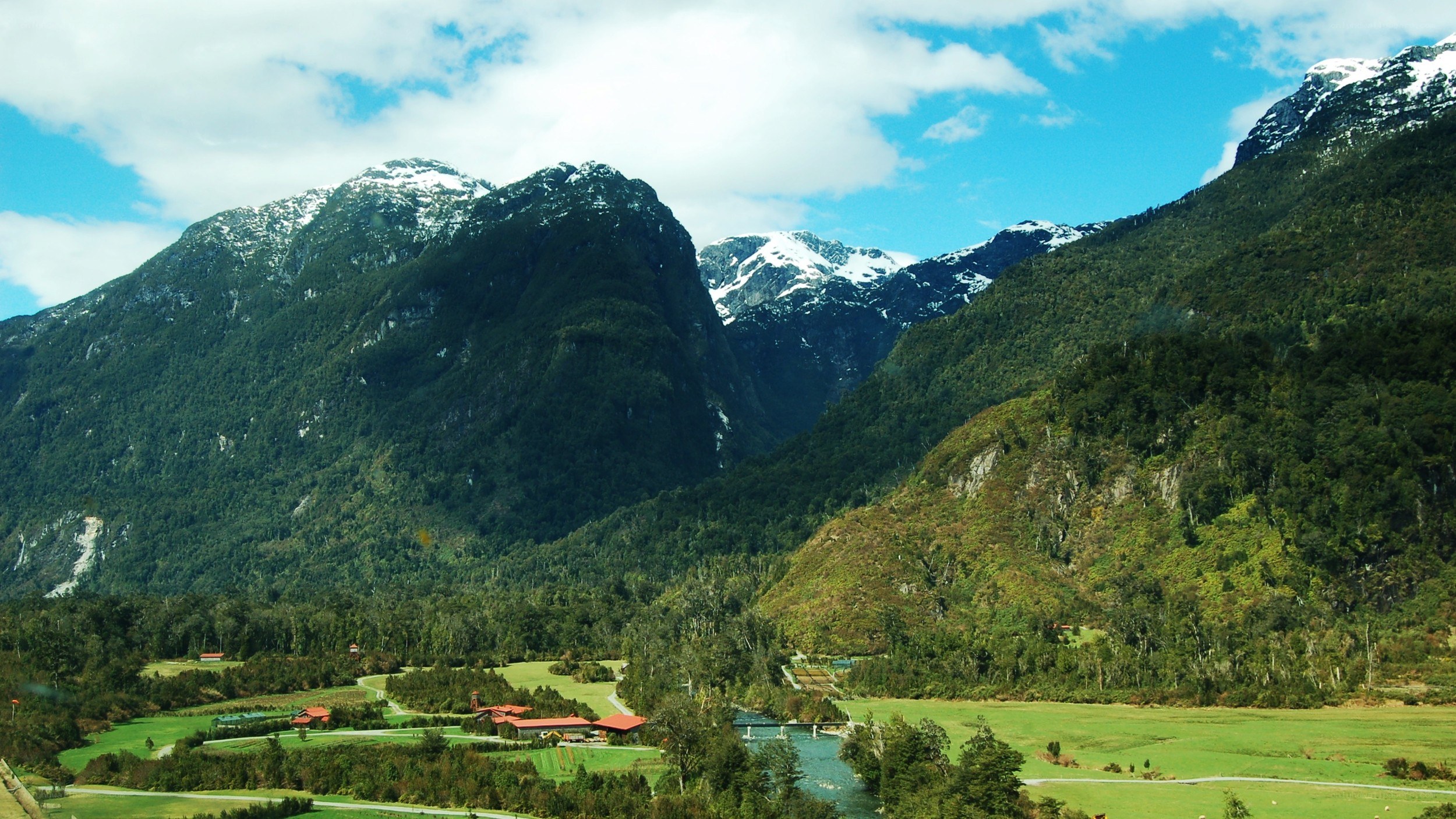 mountain valley with river and lodge