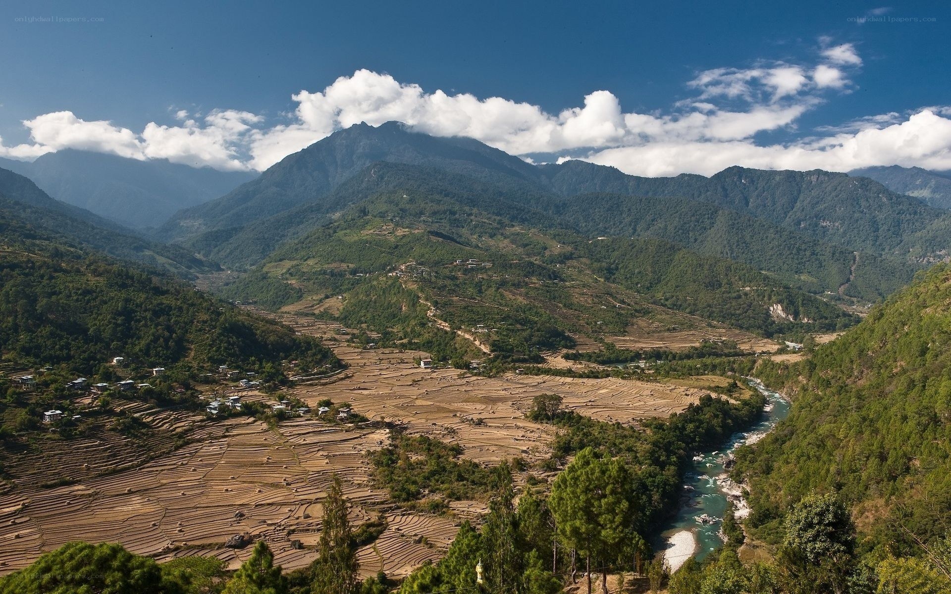 Mountain valley with river and terraced fields