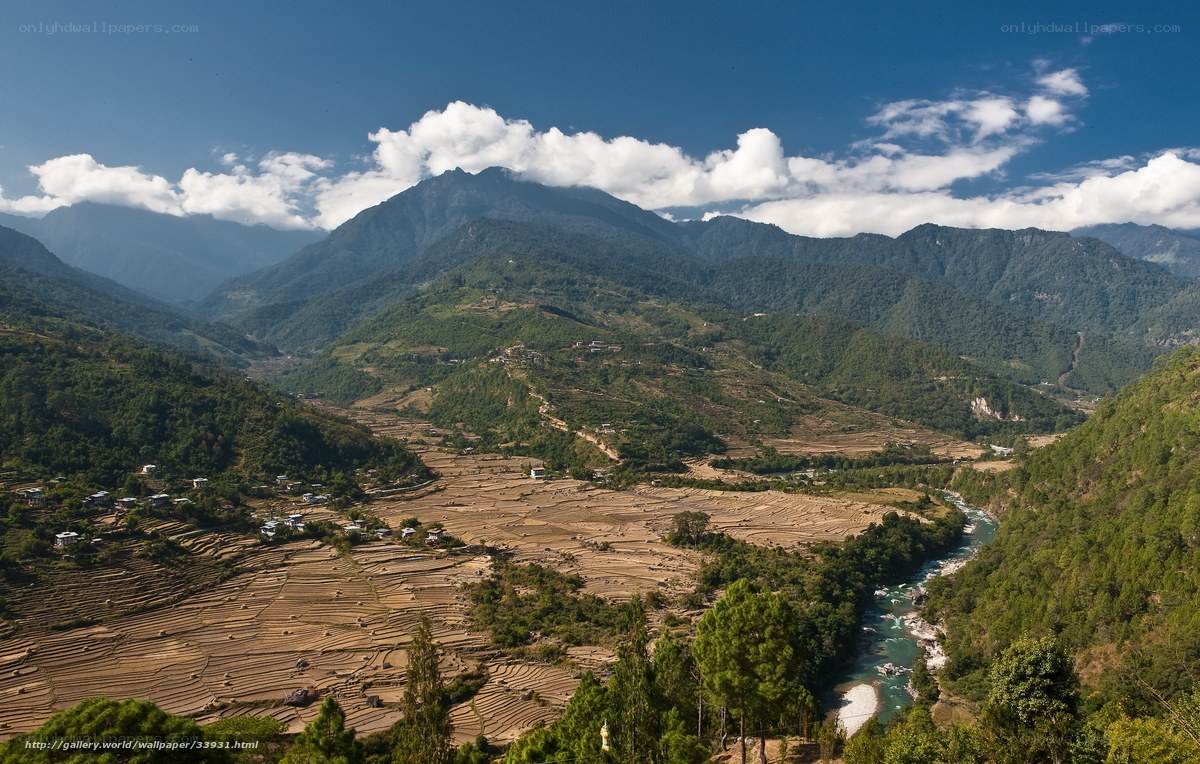 Mountain valley with river and terraced fields
