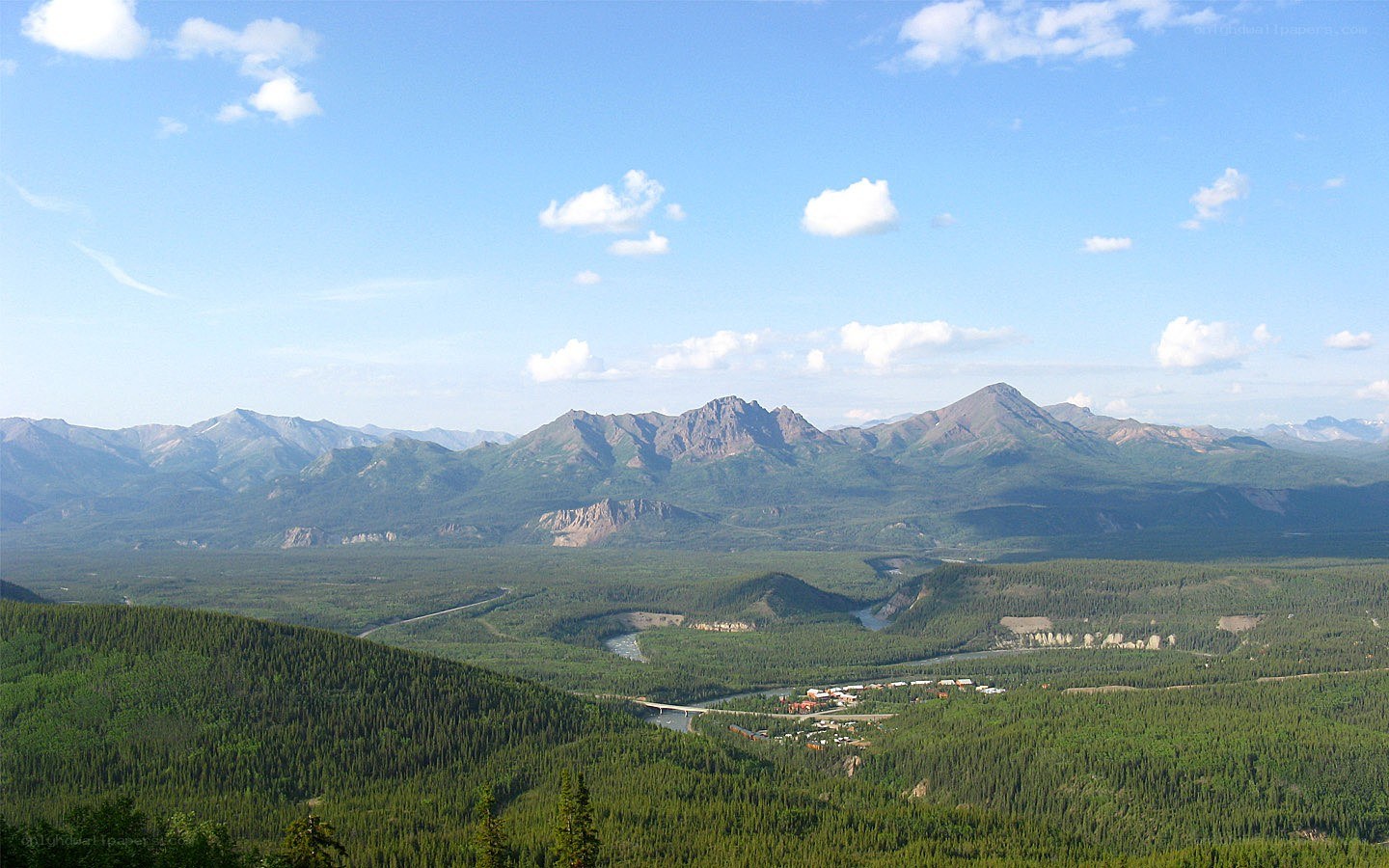 Mountain valley with river and town