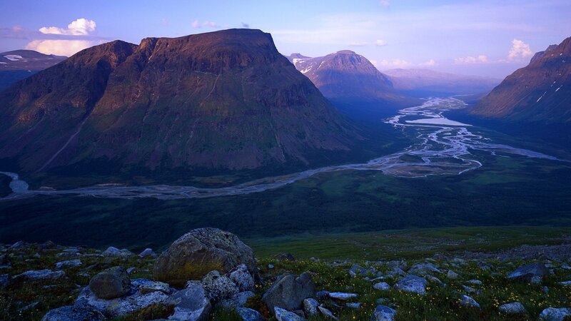 Mountain valley with river at dusk