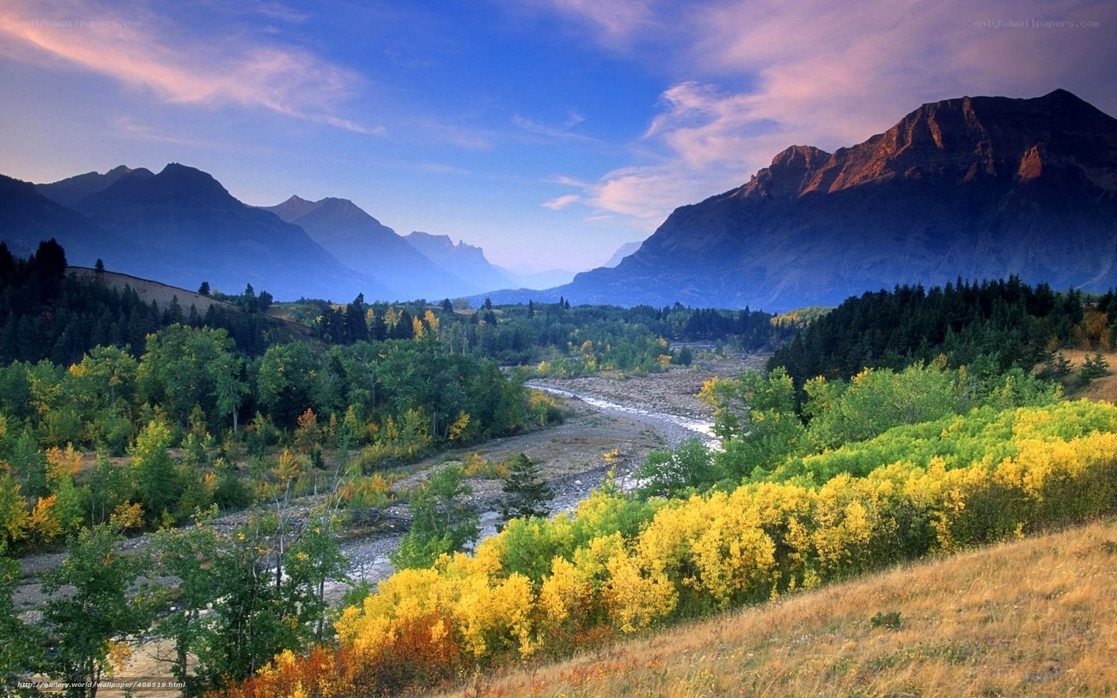 Mountain valley with river at sunset