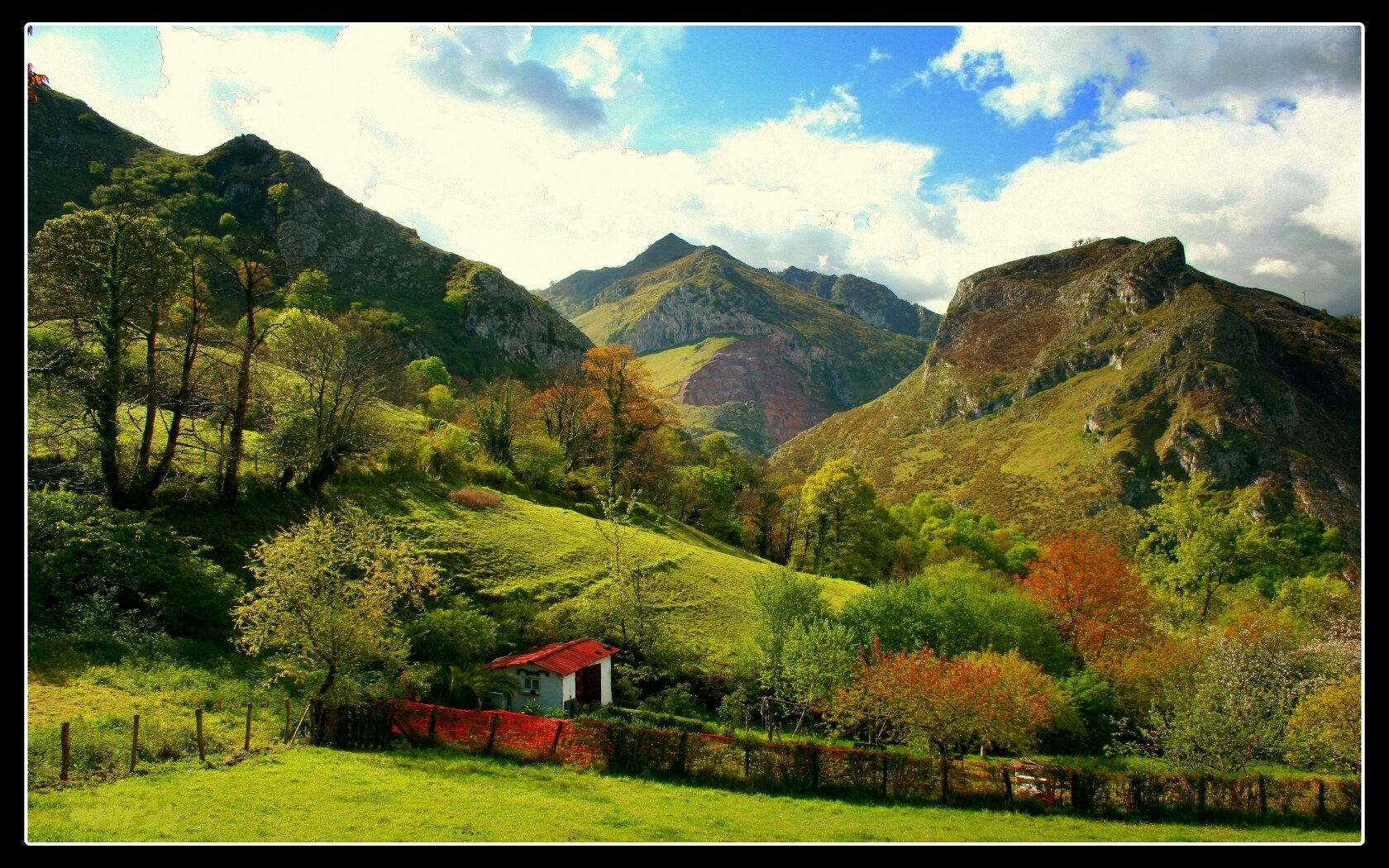 Mountain valley with small house