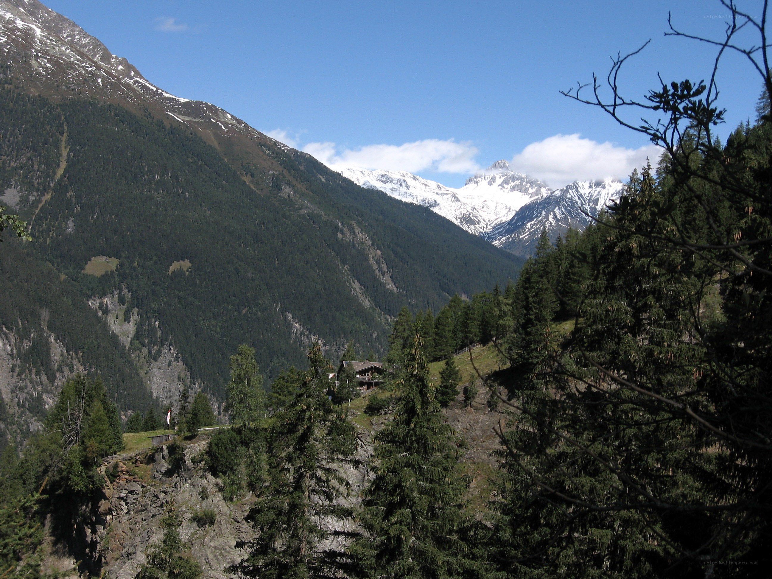 Mountain valley with snow-capped peaks