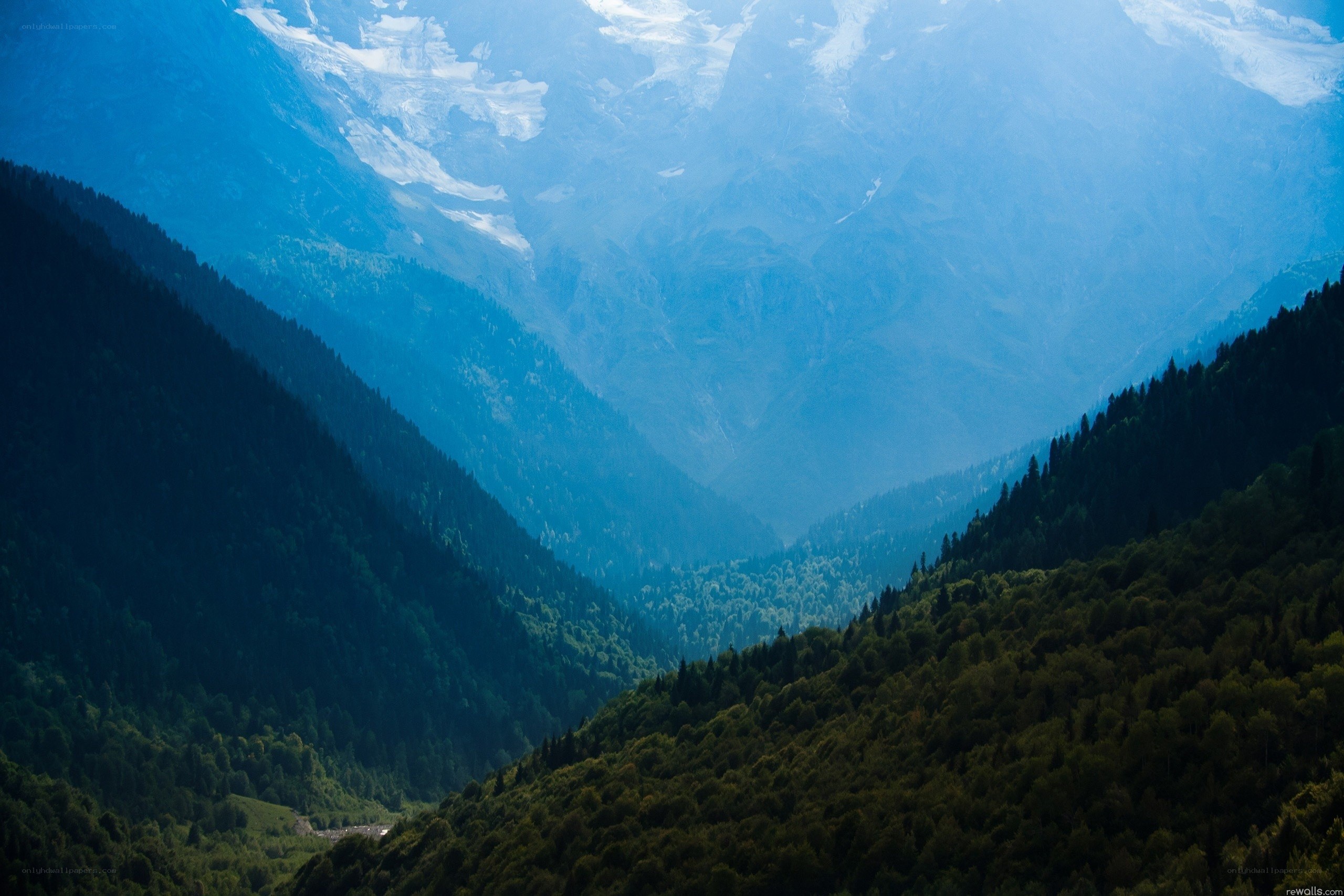 Mountain valley with snow-capped peaks