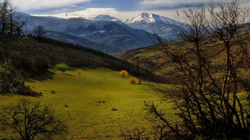 Mountain valley with snow-capped peaks