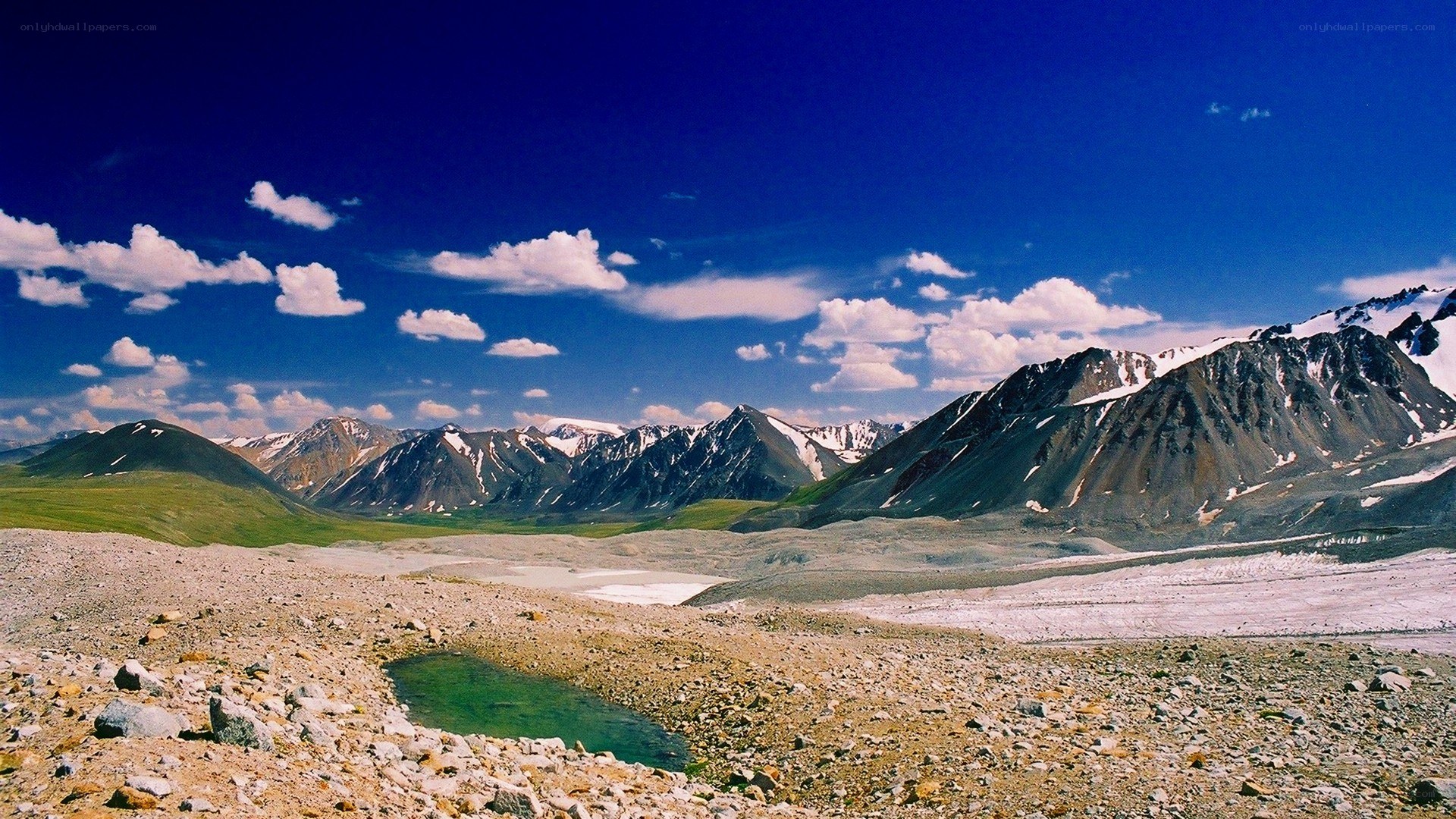 Mountain valley with snow-capped peaks