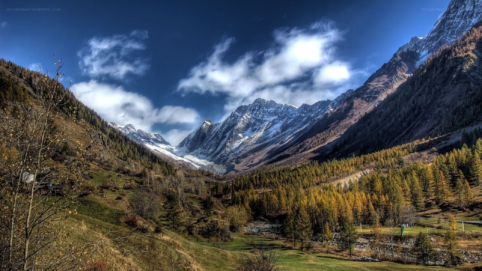 Mountain valley with snow-capped peaks