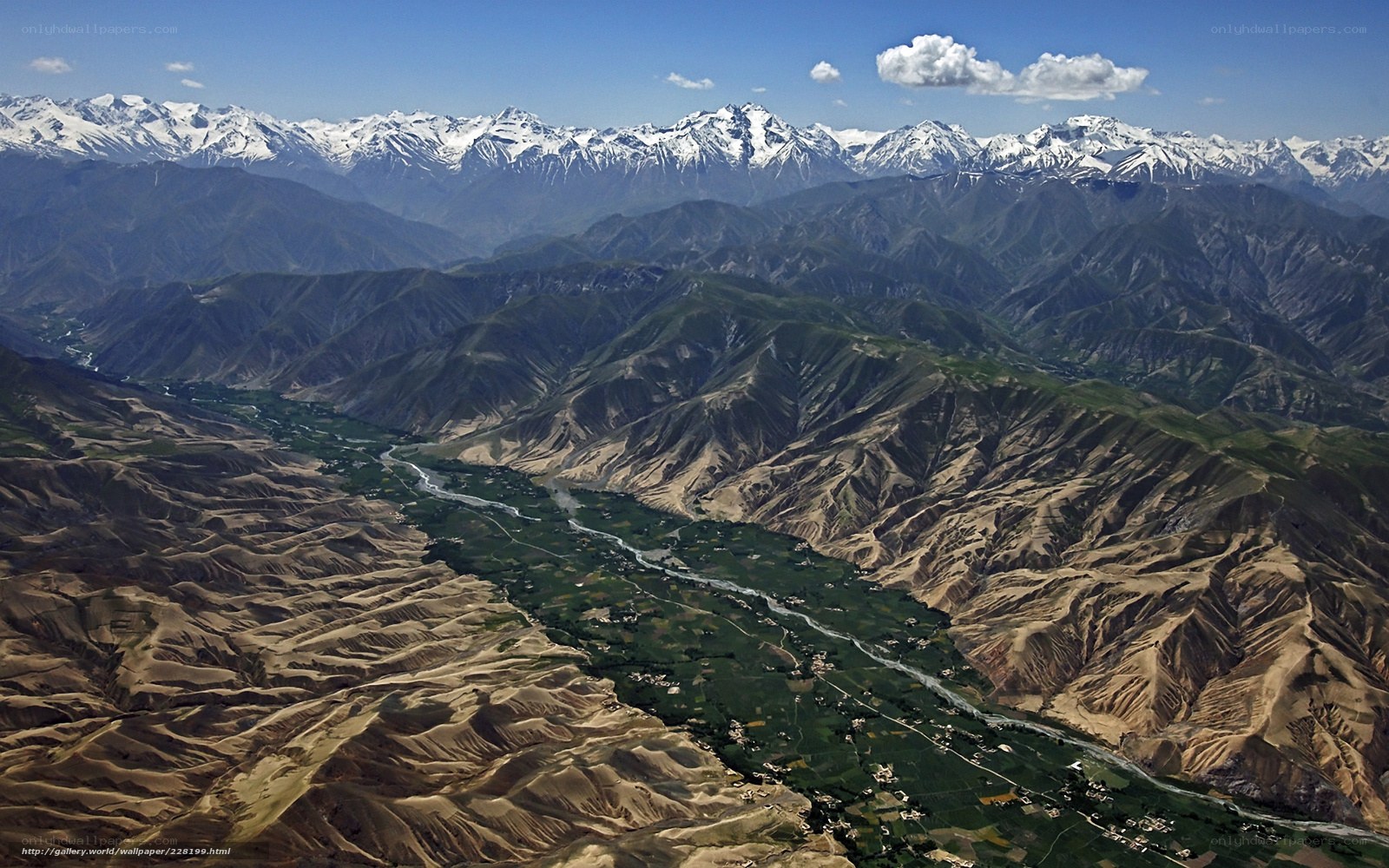 Mountain valley with snow-capped peaks