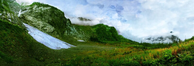 mountain valley with snow patch