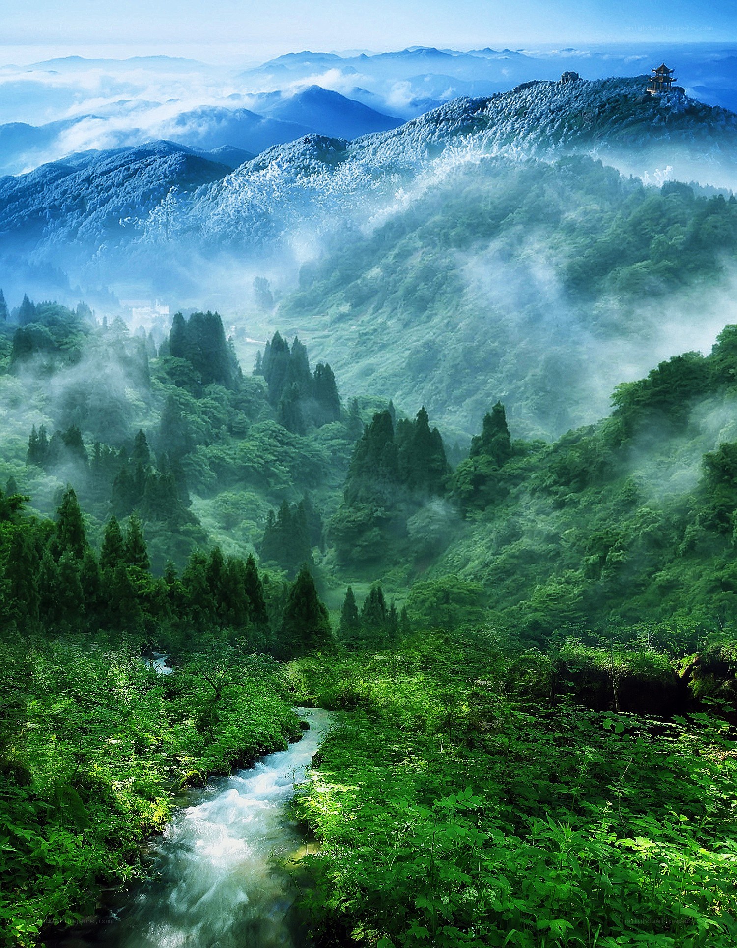 Mountain valley with stream and pagoda