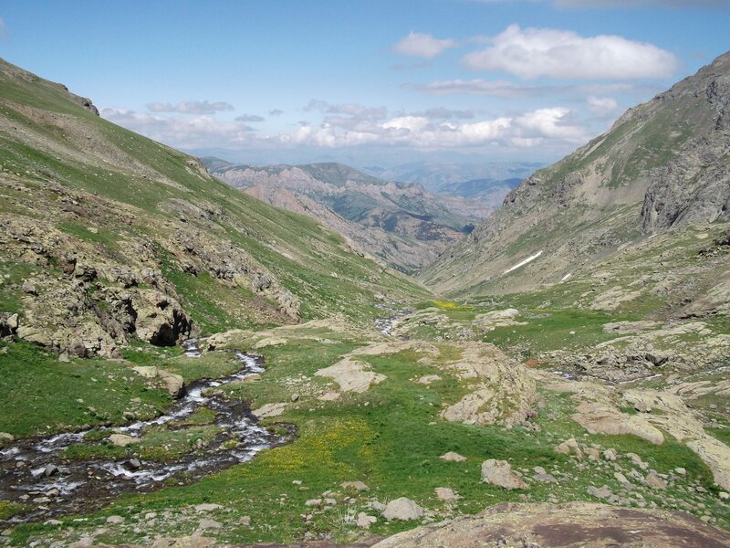 Mountain Valley with Stream — Green, Serene, Afternoon, Photograph, Grass, Rocks