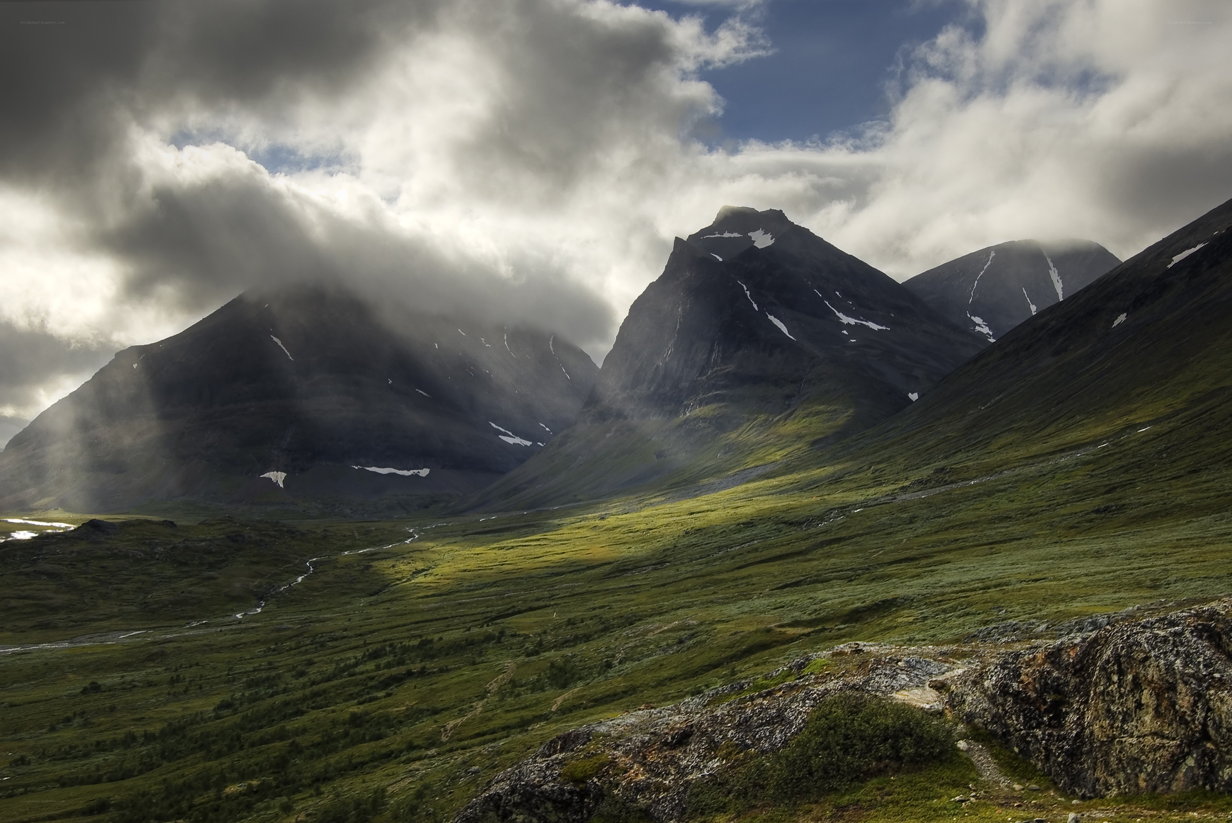 Mountain valley with sunbeams
