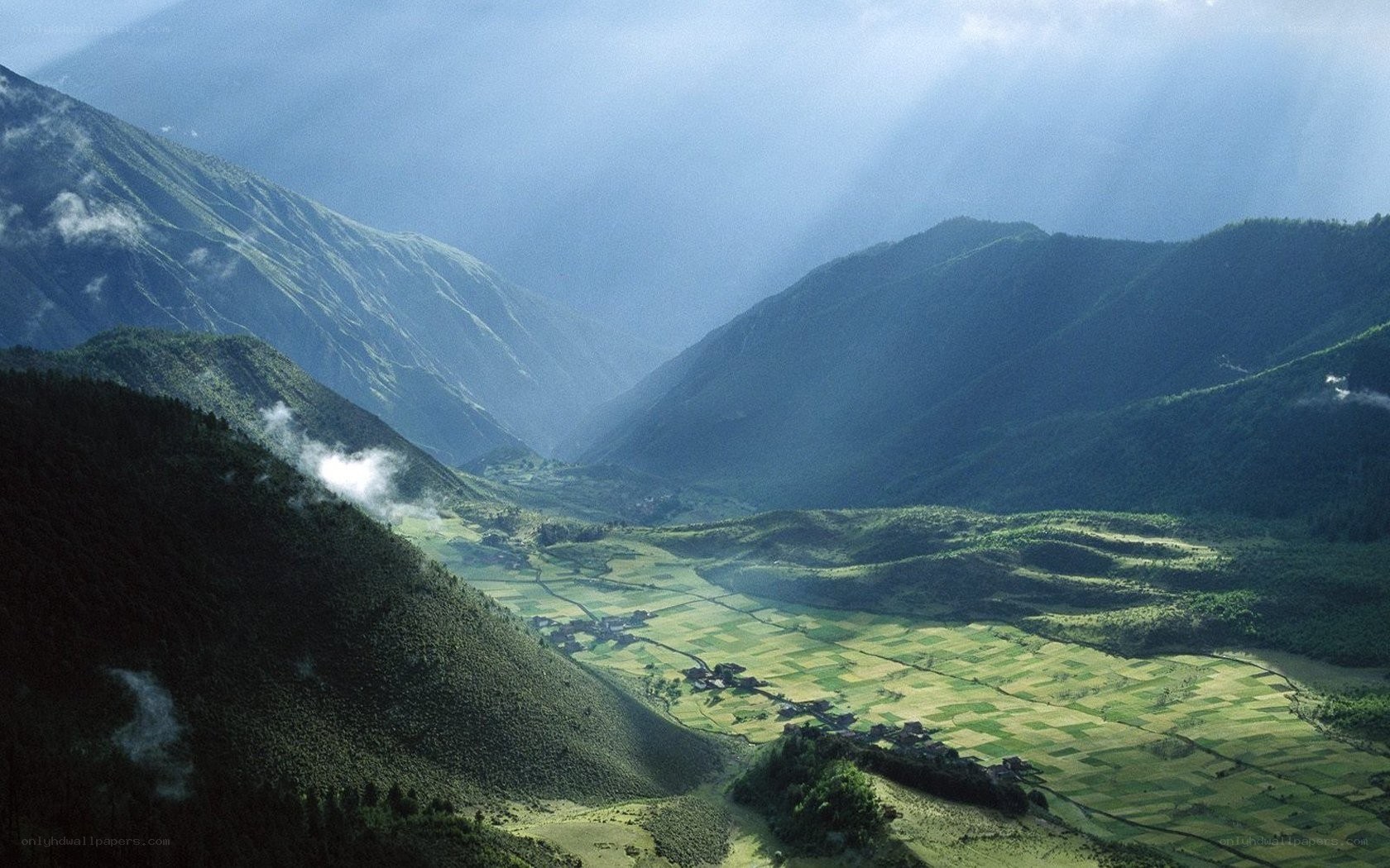 Mountain valley with sunbeams