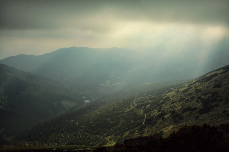 Mountain valley with sunbeams
