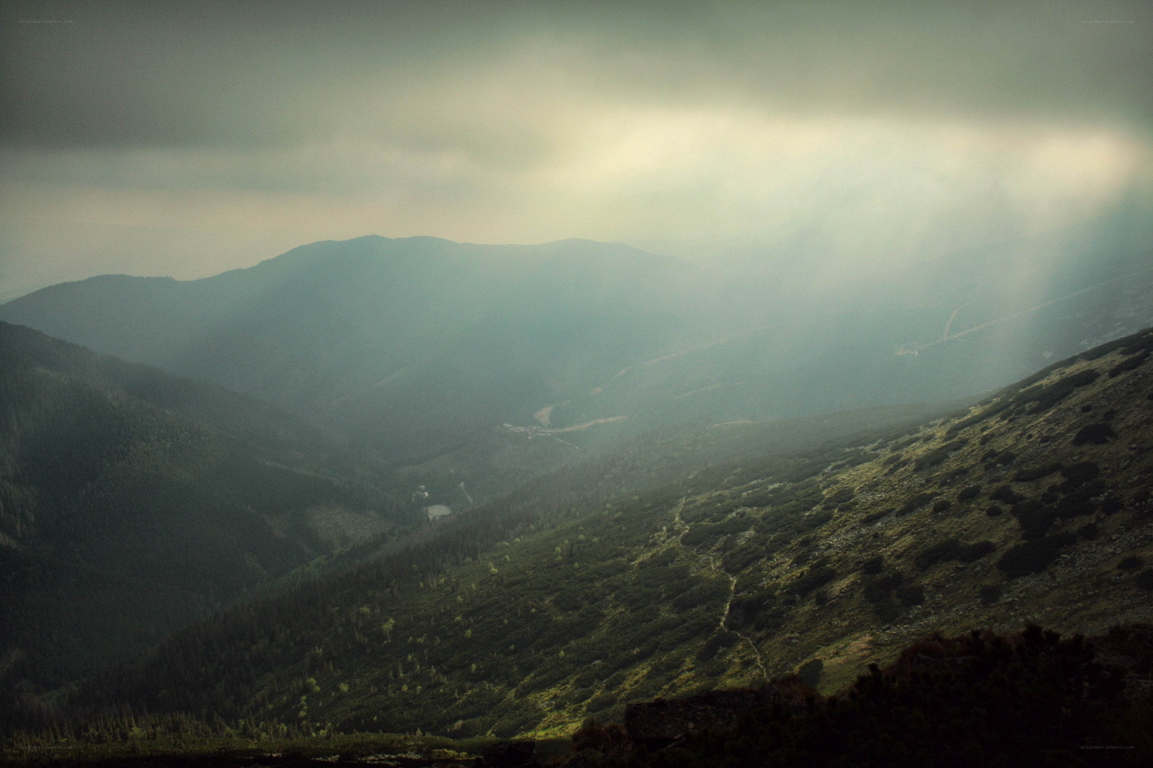 Mountain valley with sunbeams
