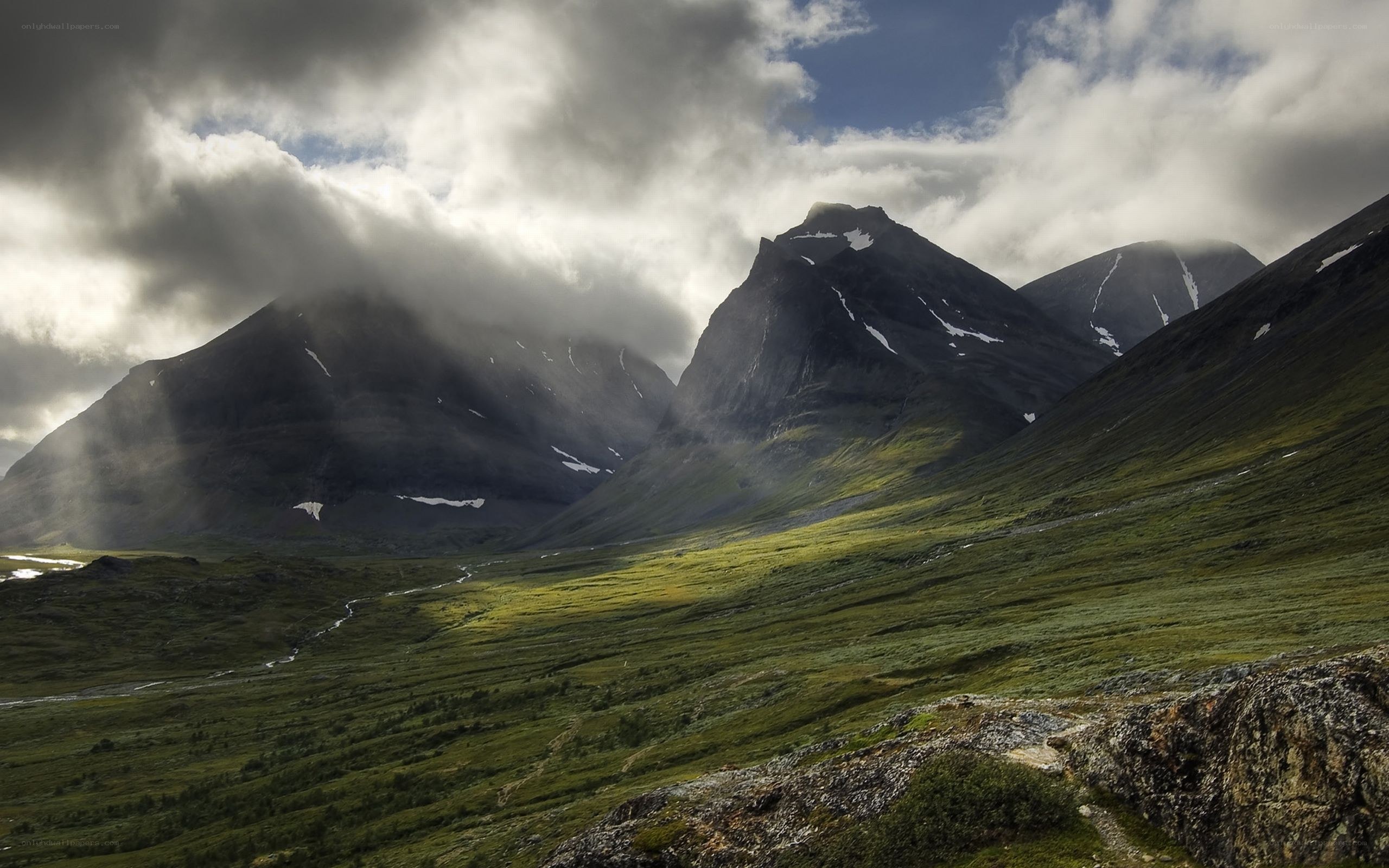 Mountain valley with sunbeams