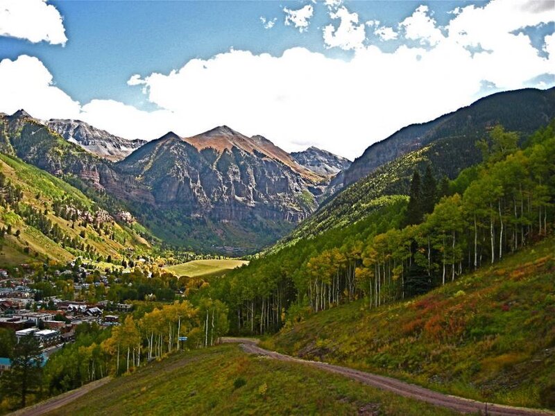 Mountain valley with town and forest