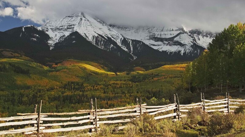Mountain valley with wooden fence
