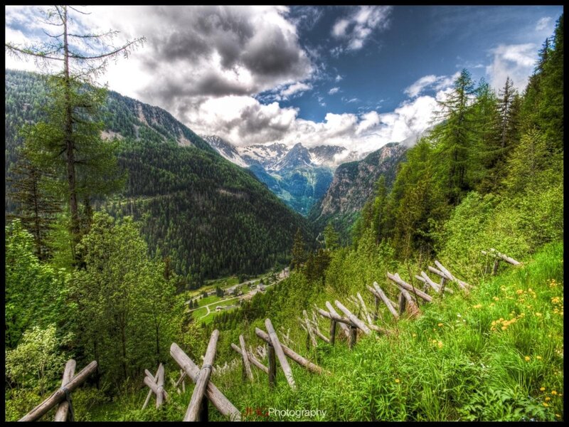 Mountain valley with wooden fence