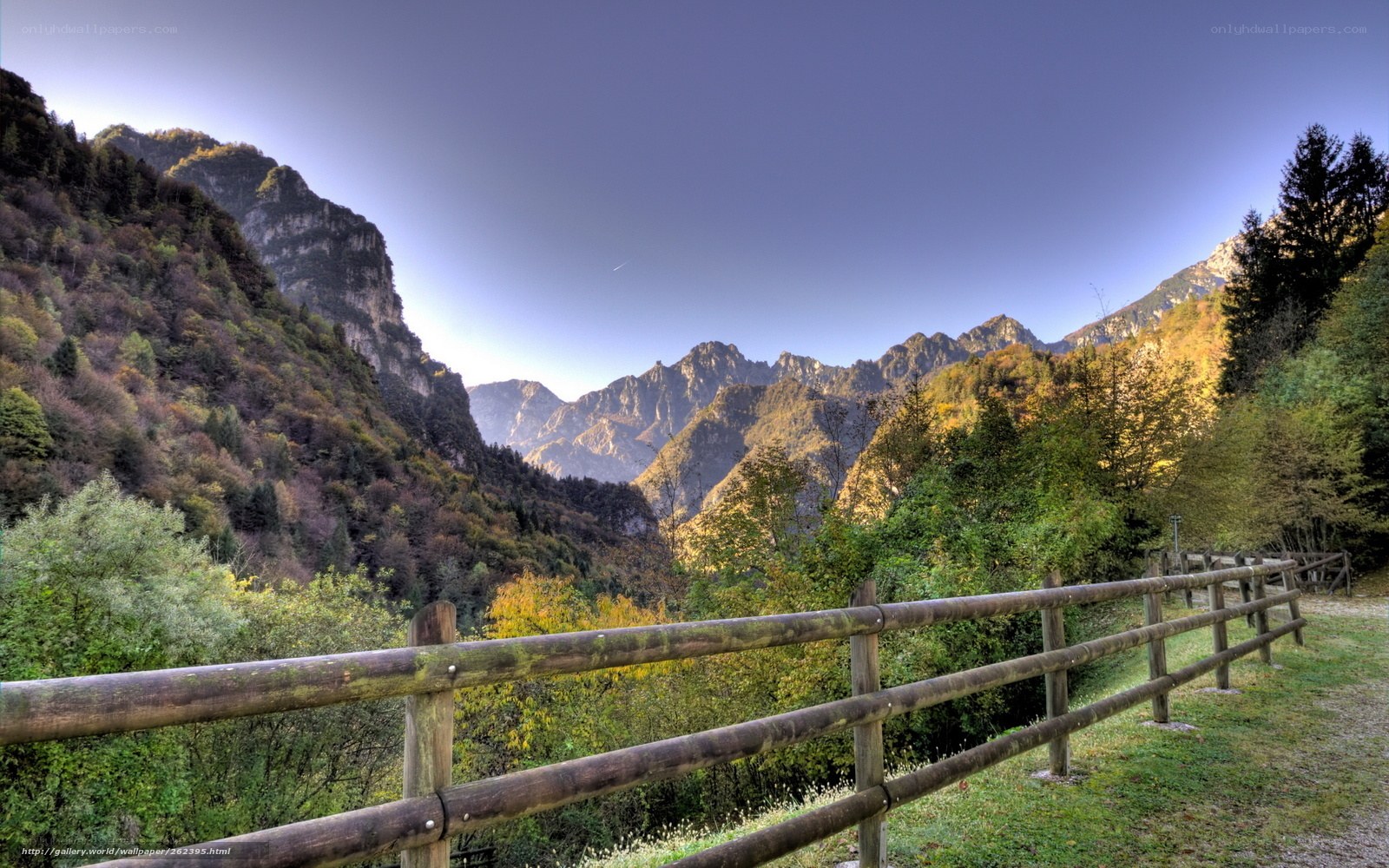 Mountain valley with wooden fence