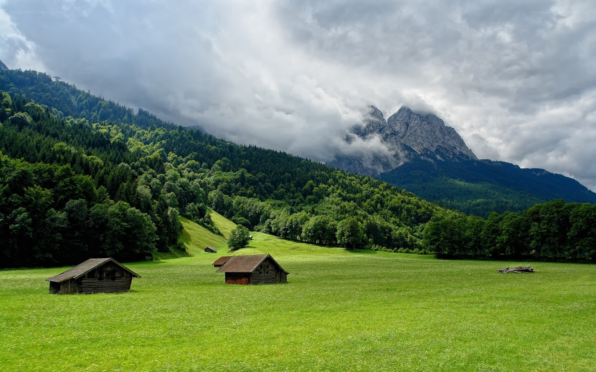 Mountain valley with wooden huts