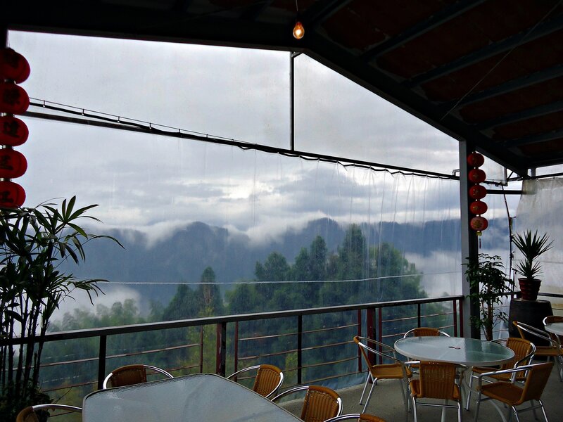 Mountain view from a rainy balcony