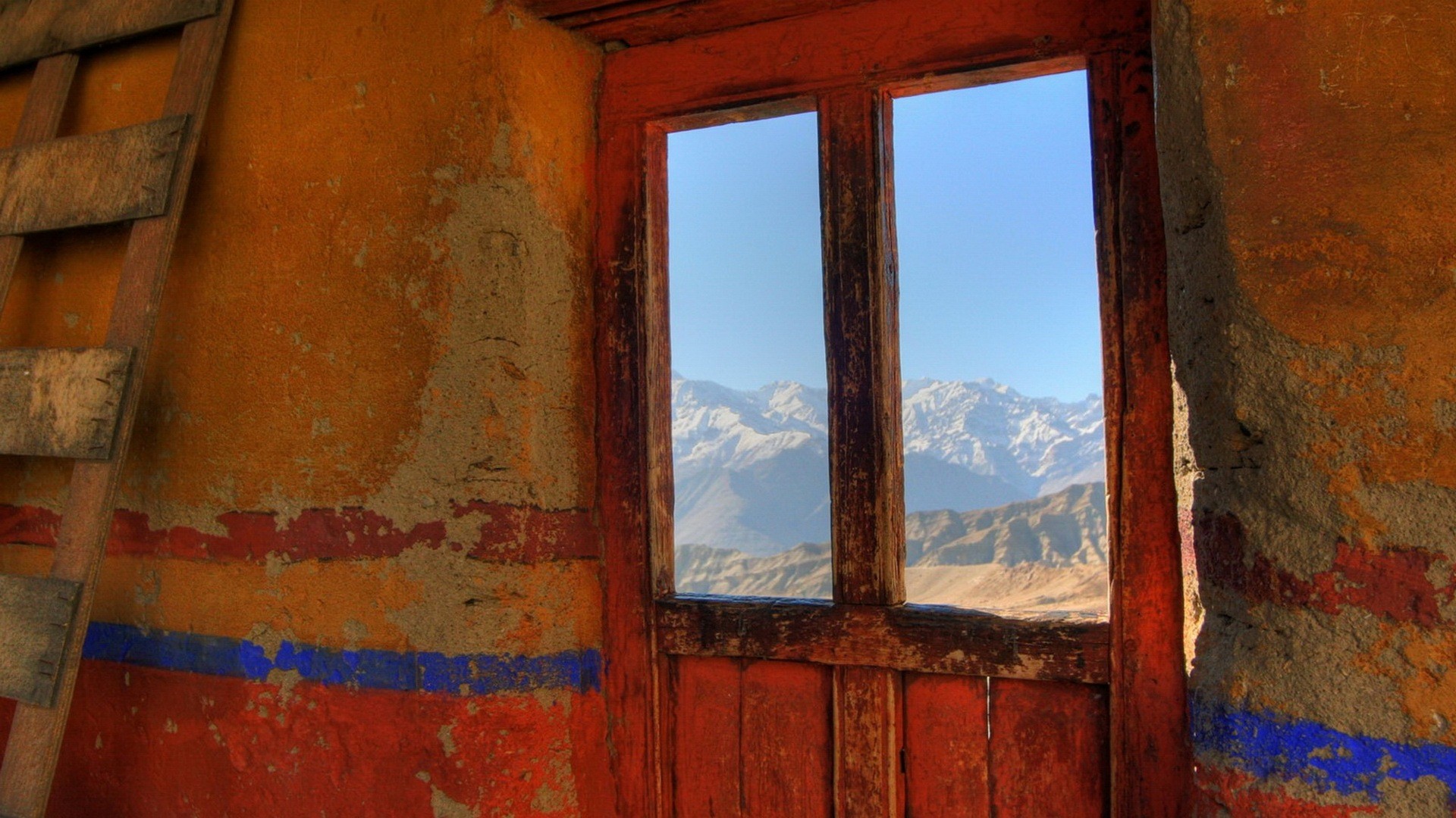 Mountain view from a rustic window