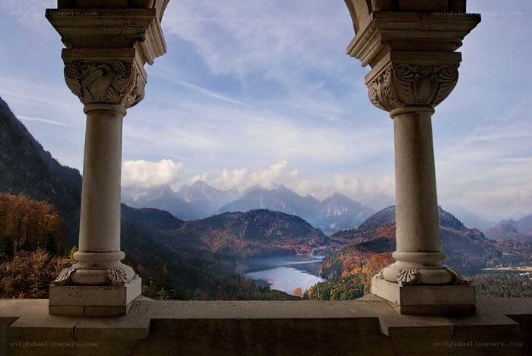 Mountain view from a stone balcony