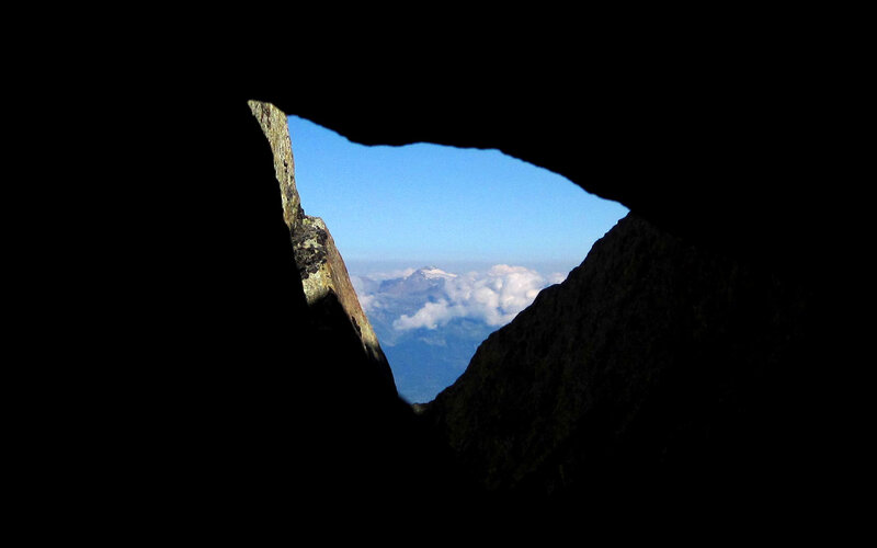 Mountain view through cave opening