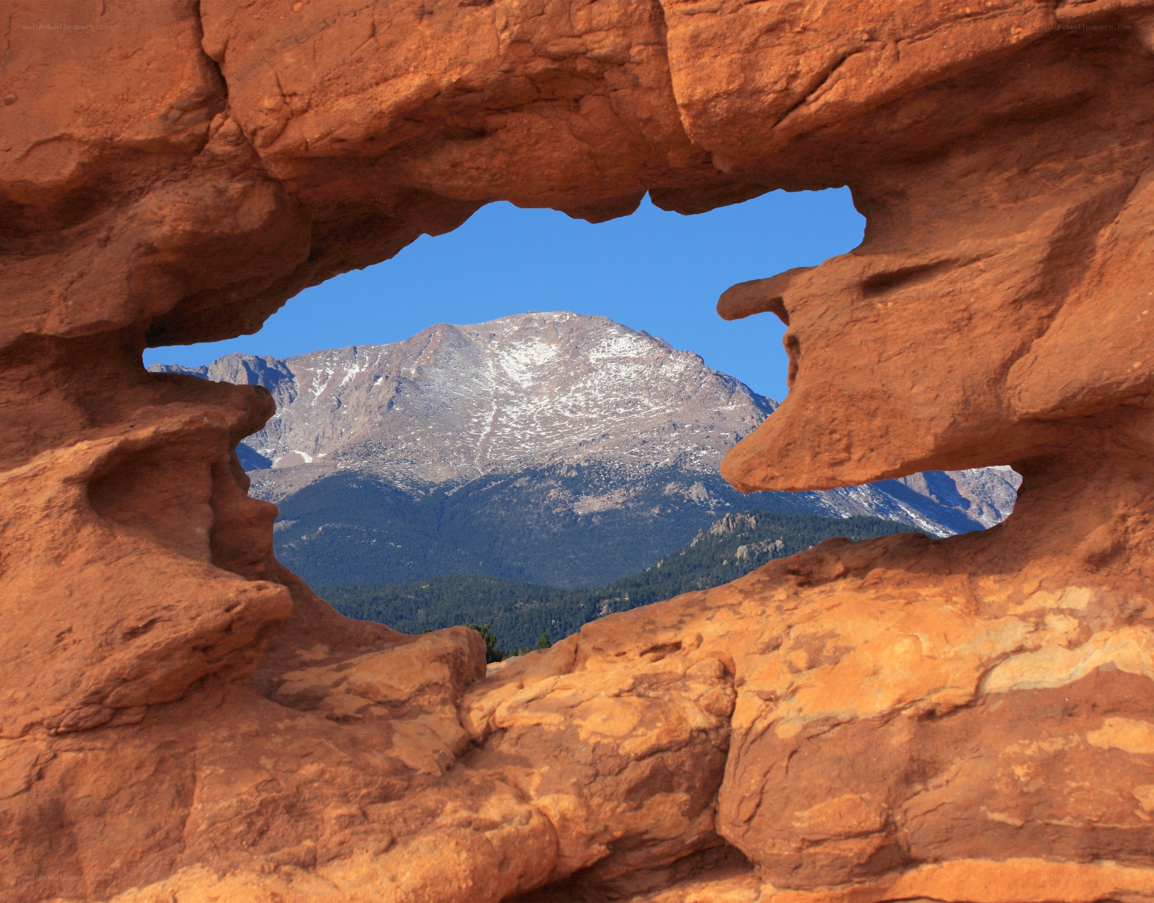 Mountain view through rock arch