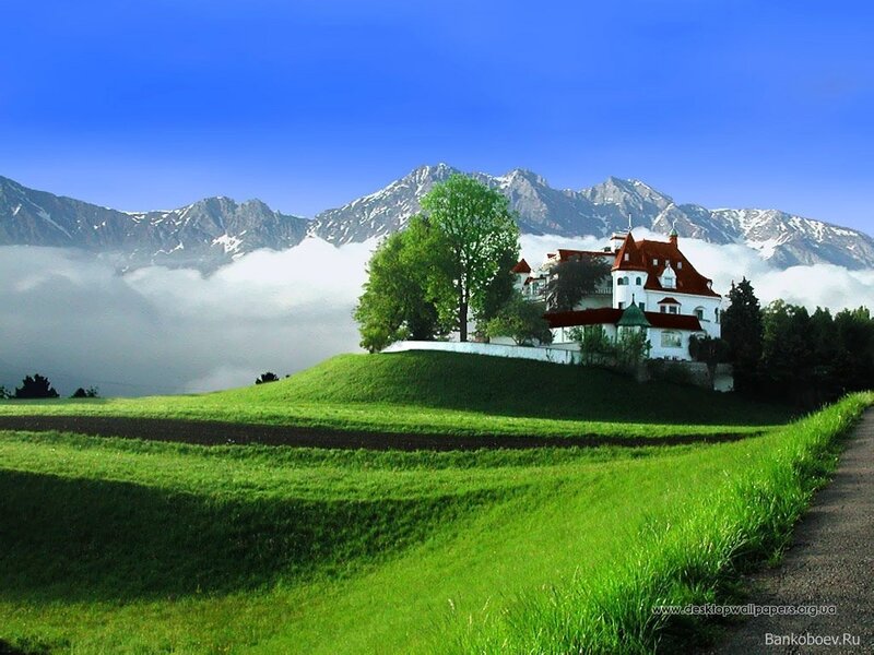 Mountain villa with green fields