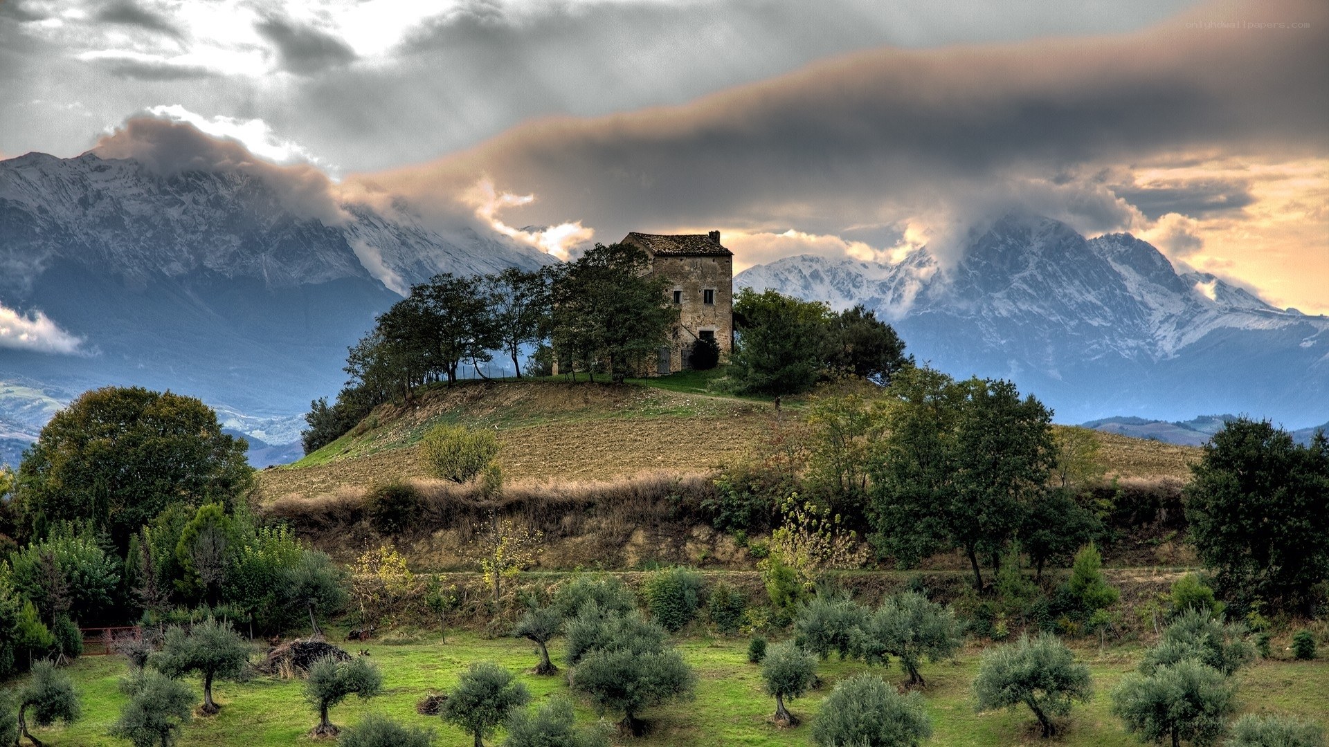 Mountain villa with snow-capped peaks