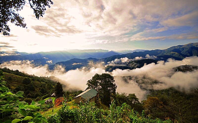 Mountain Village at Sunrise — Green, Serene, Photograph, Clouds