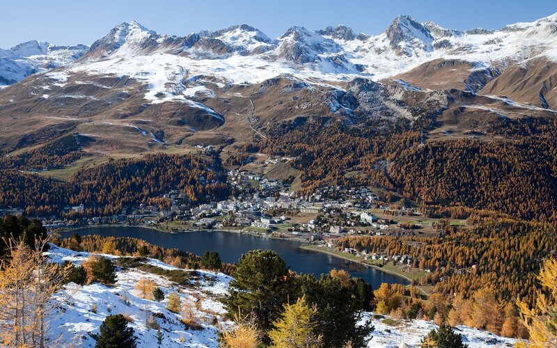 Mountain village by a lake in autumn
