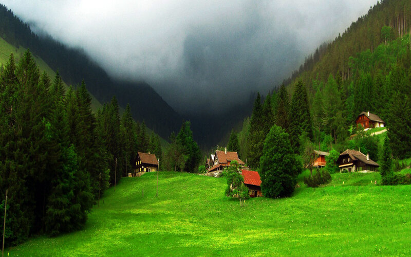 Mountain village in foggy valley
