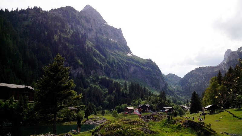 Mountain Village in Valley — Green, Serene, Afternoon, Photograph, Mountains