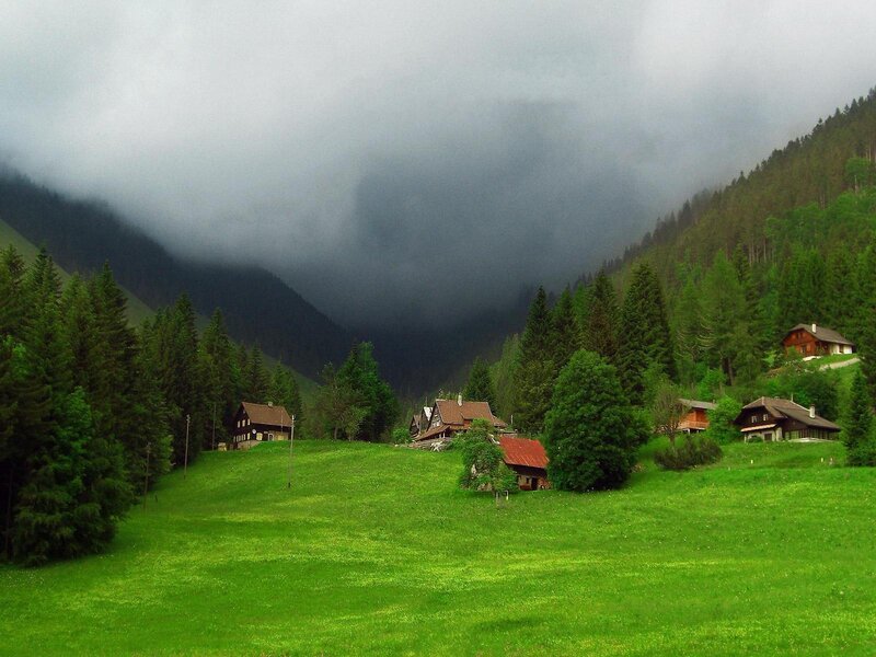 Mountain village under cloudy sky
