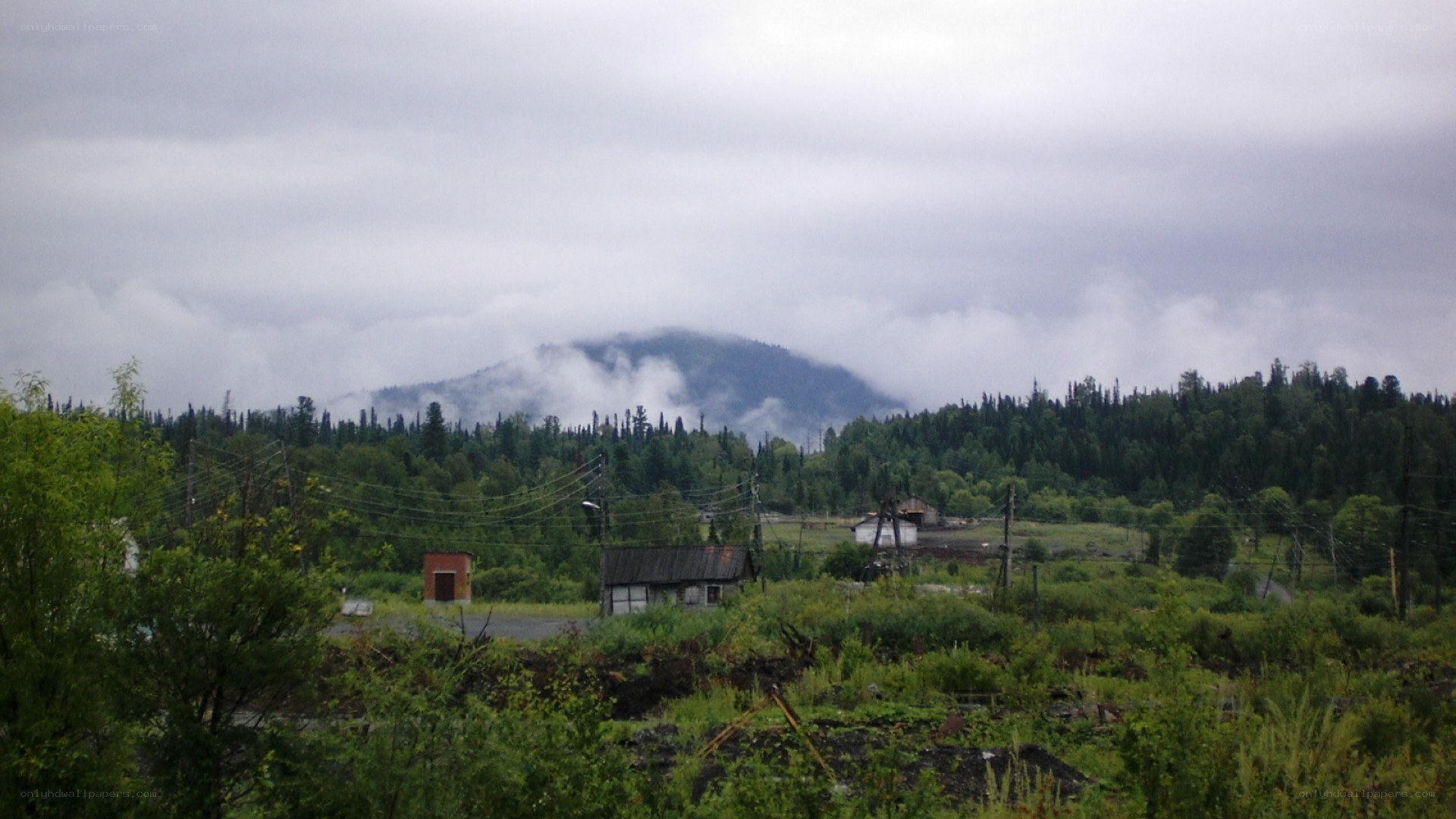 Mountain village under cloudy sky