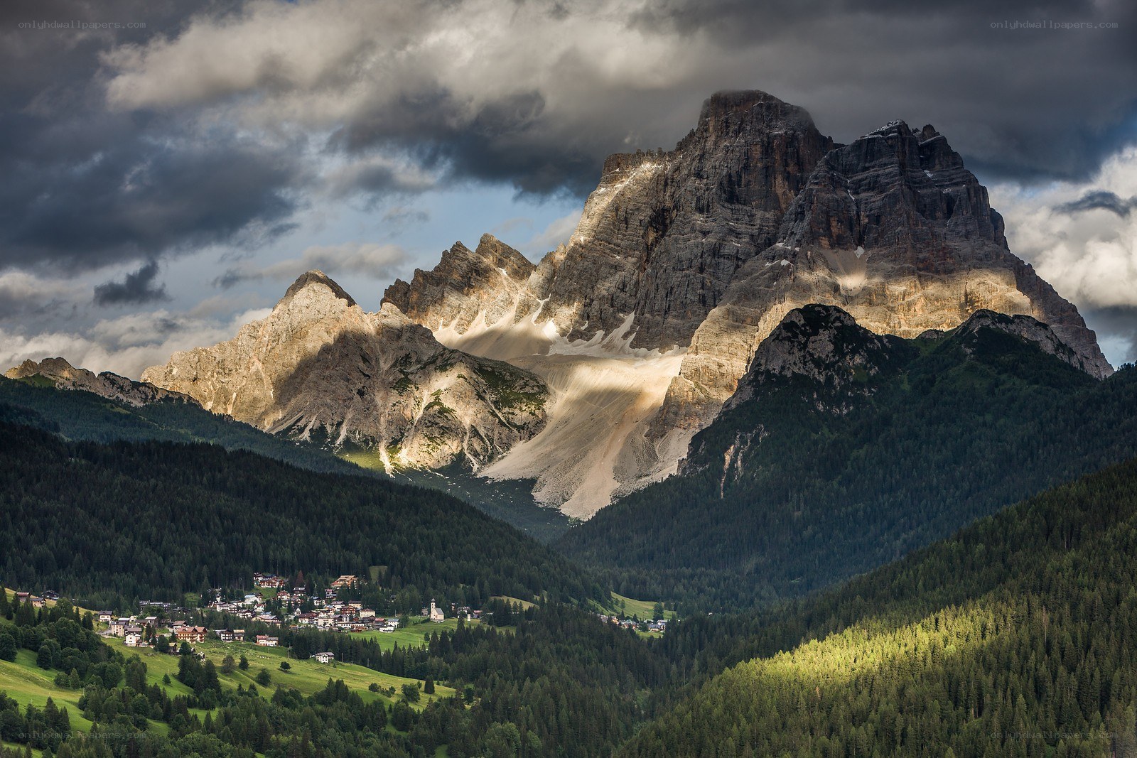 Mountain village under stormy sky