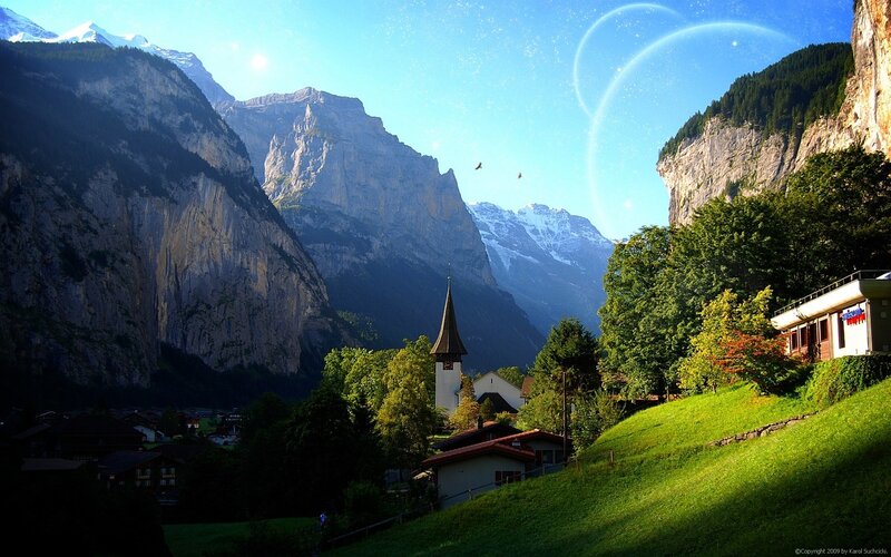 Mountain village with church and mountains