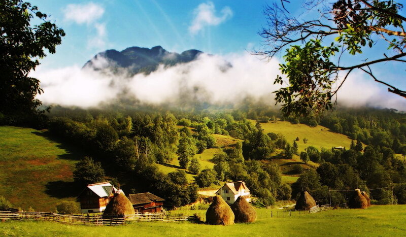 Mountain village with hay bales