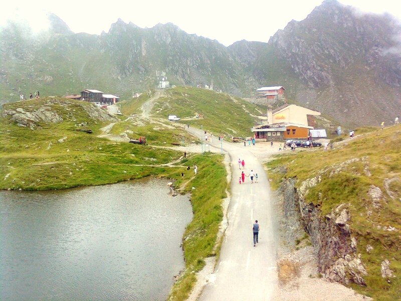 Mountain village with lake and road