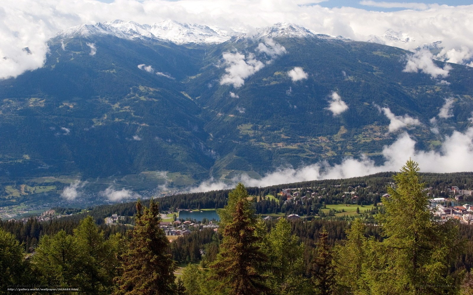 Mountain village with snow-capped peaks