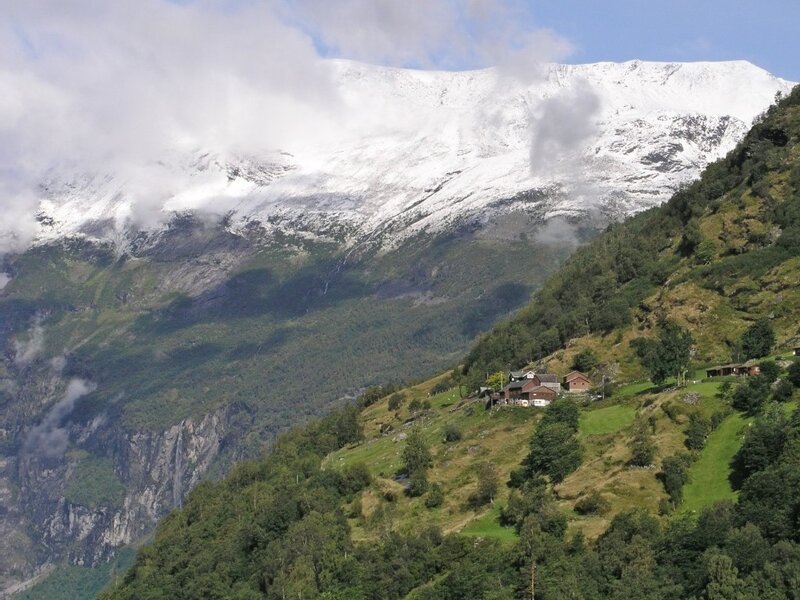 mountain village with snow-capped peaks